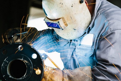 An auto darkening welding helmet protects the welder’s vision