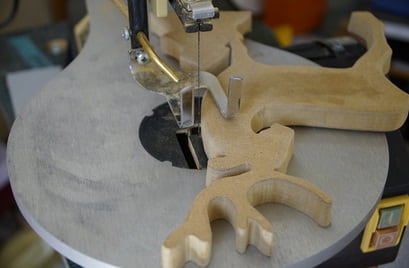The scroll saw is set with a plate.